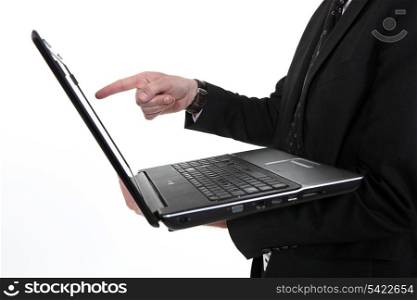 Man pointing at laptop screen