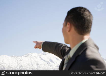 Man pointing at mountains