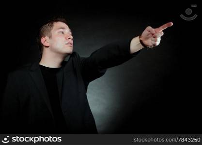 man pointing at something interesting showing your product black background