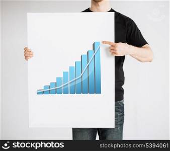 man pointing his finger on board with 3d graph