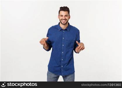 Man pointing showing copy space isolated on white background. Casual handsome Caucasian young man. Man pointing showing copy space isolated on white background. Casual handsome Caucasian young man.