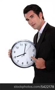 Man pointing to clock