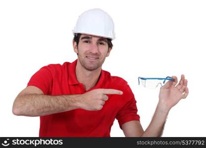 Man pointing to his goggles