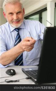 Man pointing to his laptop