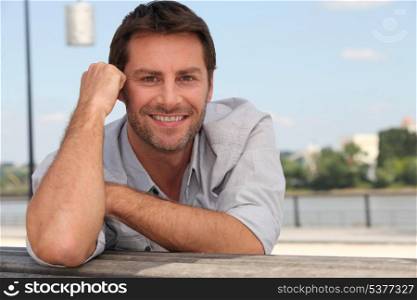 Man posing on a quay