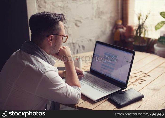 Man posing on workplace in startup office