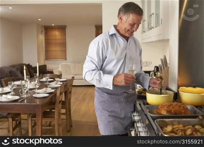 Man Preparing Food For A Dinner Party