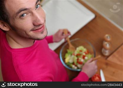 Man preparing healthy salad
