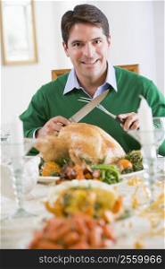Man Preparing To Carve A Turkey