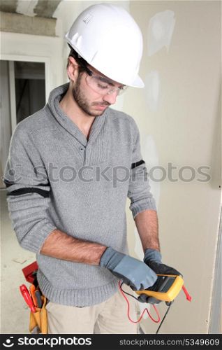 Man preparing voltmeter