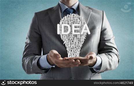 Man presenting idea. Businessman holding in hands successful idea concept