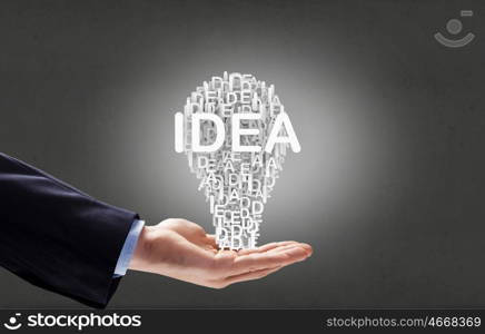 Man presenting idea. Businessman holding in hands successful idea concept