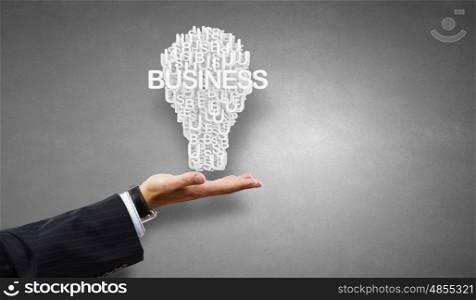 Man presenting idea. Businessman holding in hands successful idea concept