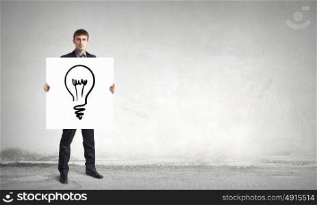 Man presenting idea. Young businessman holding banner with good idea concept