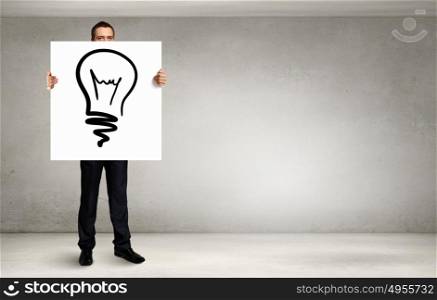 Man presenting idea. Young businessman holding banner with good idea concept