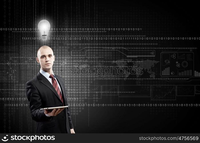 Man presenting tablet pc. Young bald businessman with tablet pc against digital background