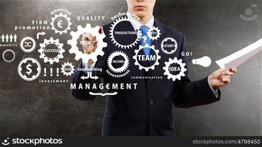 Man presenting teamwork concept. Close view of businessman drawing teamwork concept on screen