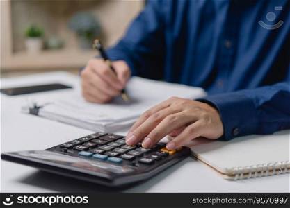 man pressing a calculator accounting and finance banking. Business marketing, money management, Tax and Investment Concept.