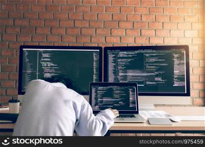 Man programmers are sleeping while working analyzing on desk in code at office room.