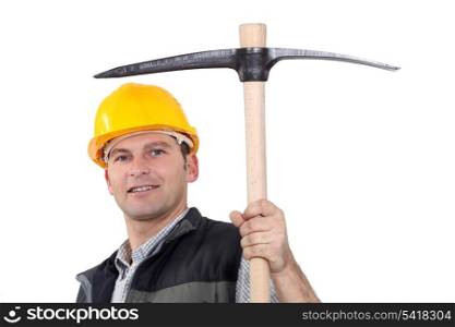 Man proudly displaying pick-axe