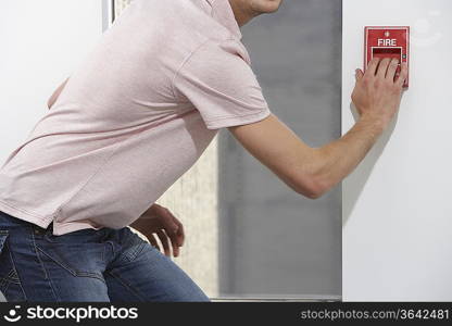 Man Pulling Fire Alarm