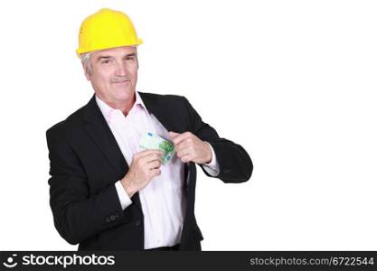 Man pulling money out of his pocket