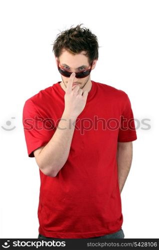 Man pushing his sunglasses up his nose