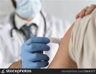 man putting bandage young woman s arm. High resolution photo. man putting bandage young woman s arm. High quality photo