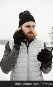 man putting earphones medium shot