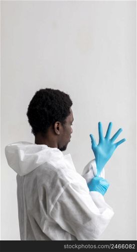 man putting protective equipment