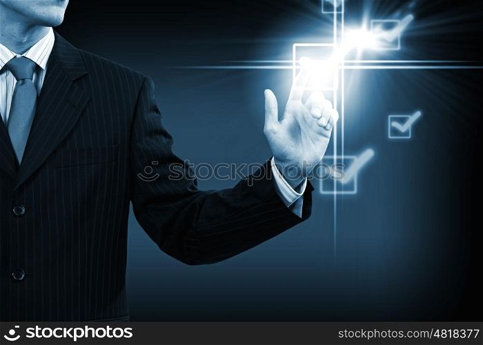 Man putting tick. Close up of businessman pushing icon of media screen