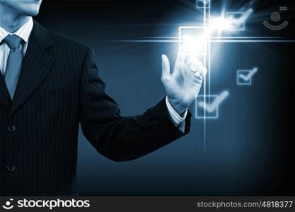 Man putting tick. Close up of businessman pushing icon of media screen