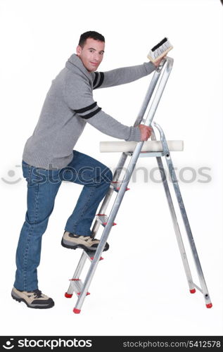 Man putting up wallpaper