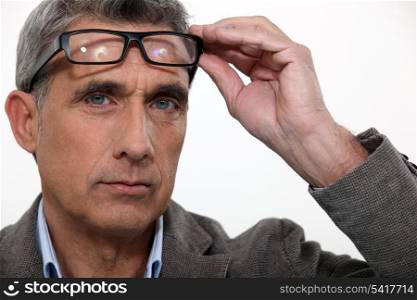Man raising his glasses