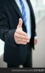 Man reaching out to shake hands