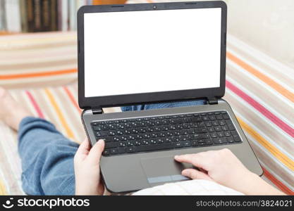 man read on laptop with cut out screen in living room