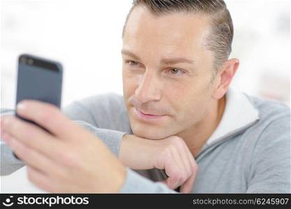 Man reading a text message
