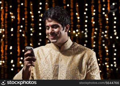Man reading an sms on mobile phone