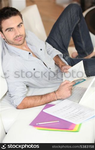 Man reading at home