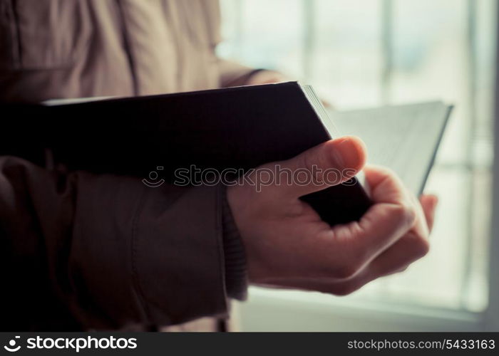 Man reading. Book in his hands.