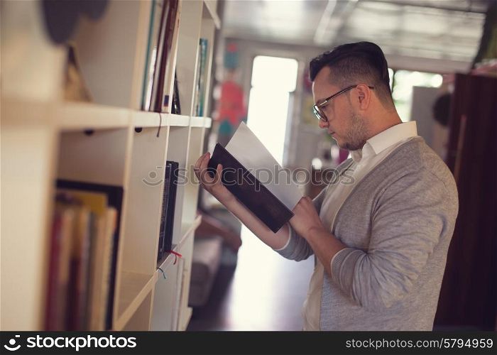 Man reading book in startup office