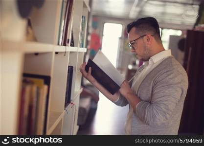 Man reading book in startup office