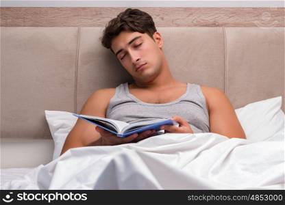 Man reading book in the bed