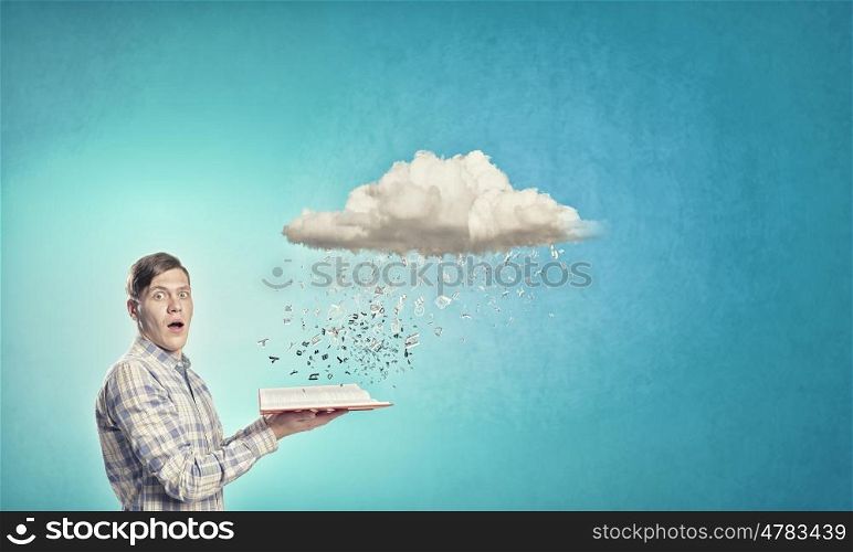 Man reading book. Young man with book in hands and cloud concept