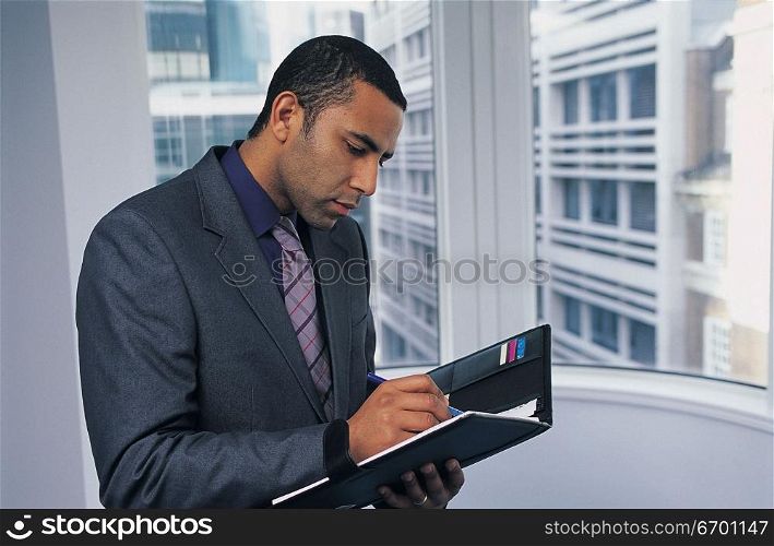 man reading document in office