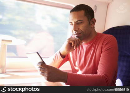 Man Reading E Book On Train