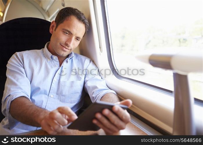Man Reading E Book On Train