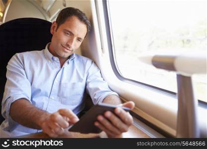 Man Reading E Book On Train
