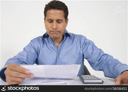 Man Reading Financial Document