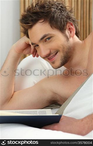 Man reading in bed